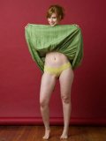 Young Beauty Model Chick Amber Dawn Is Hotly Taking Off Her Green Dress And Showing Her Tiny Ass
