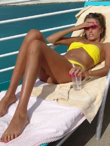 Lori Anderson In Pink Shades And Yellow Bikini Demonstrates Her Hairy Arms In The Sun