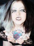 Gothic Mad Sophie Dressed In Black Exposes Her Tattooed Chest And Shaved Snatch
