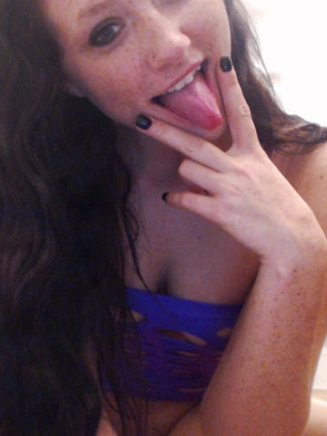 Brunette Freckles Puts On A Slutty, Purple Outfit And Teases In A Softcore Gallery.