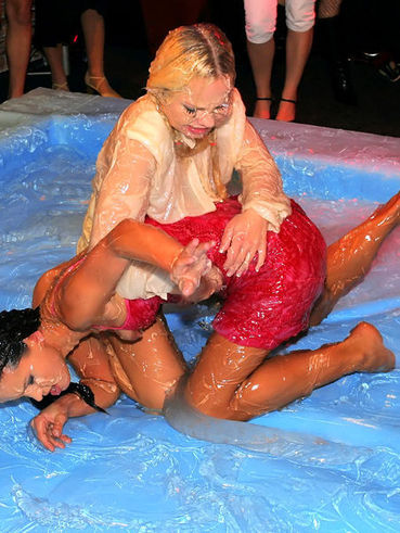 Sharka Blue And Lora Licious Start Oil Wrestling In Beautiful Dresses And Continue In Wet Pantie