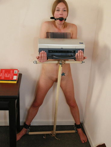 Undressed Ball Gagged Star Holds The Printer Of Man For Loves Playing With Slaves